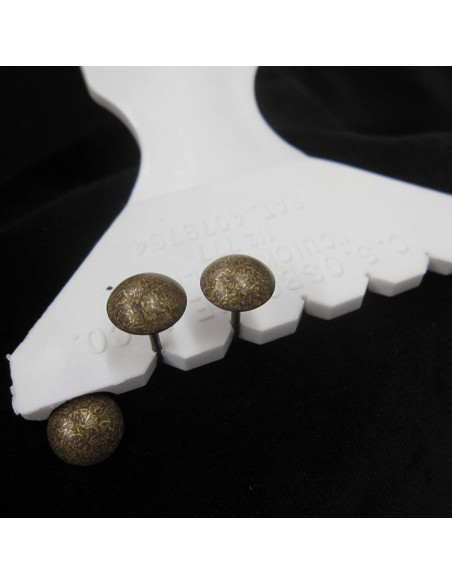 Upholstery nail spacer