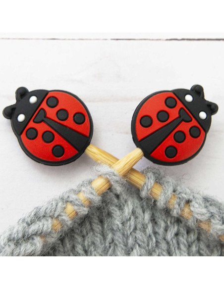 Ladybug stitch stoppers for knitting needles