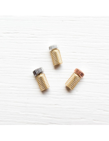 Metal protective caps for hand needles