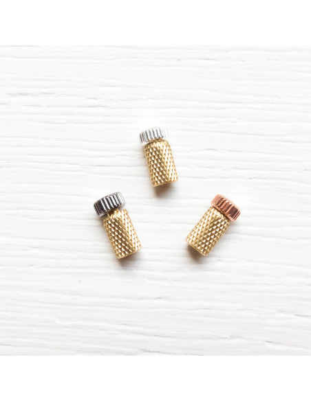 Metal protective caps for hand needles