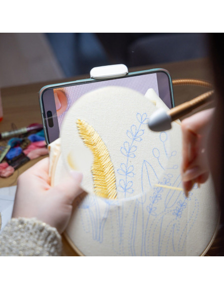 Lamp on table with magnifying glass, tray, and phone clamp Daylight Anita