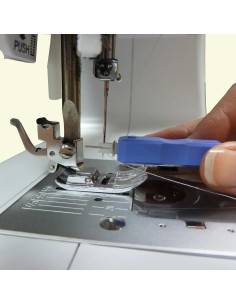 Thread a sewing machine needle with a magnet