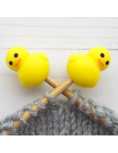 Yellow duck stitch stoppers for knitting needles