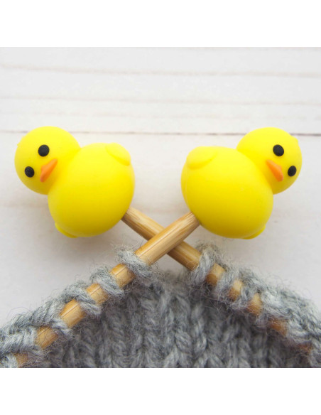 Yellow duck stitch stoppers for knitting needles
