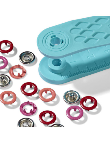 Box of 21 red, coral, and fuchsia jersey snap buttons with 8 mm tool