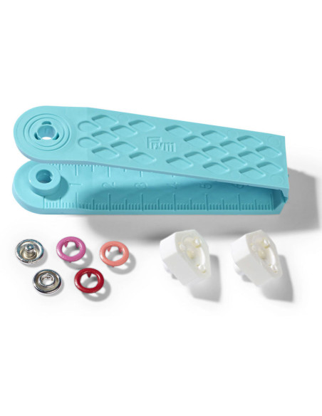 Box of 21 red, coral, and fuchsia jersey snap buttons with 8 mm tool
