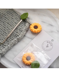 Yellow daisy stitch stoppers for knitting needles