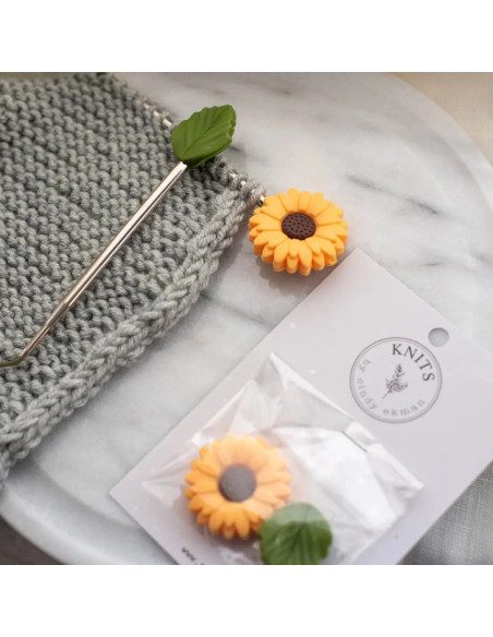 Yellow daisy stitch stoppers for knitting needles